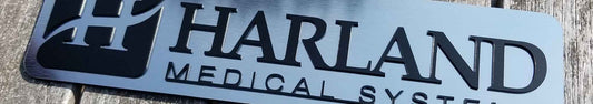 Harland Medical Systems Emblem